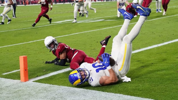 Dec 13, 2021; Glendale, Arizona, USA; Los Angeles Rams wide receiver Cooper Kupp (10) makes a touchdown catch against Arizona Cardinals cornerback Marco Wilson (20) at State Farm Stadium.

Nfl Los Angeles Rams At Arizona Cardinals